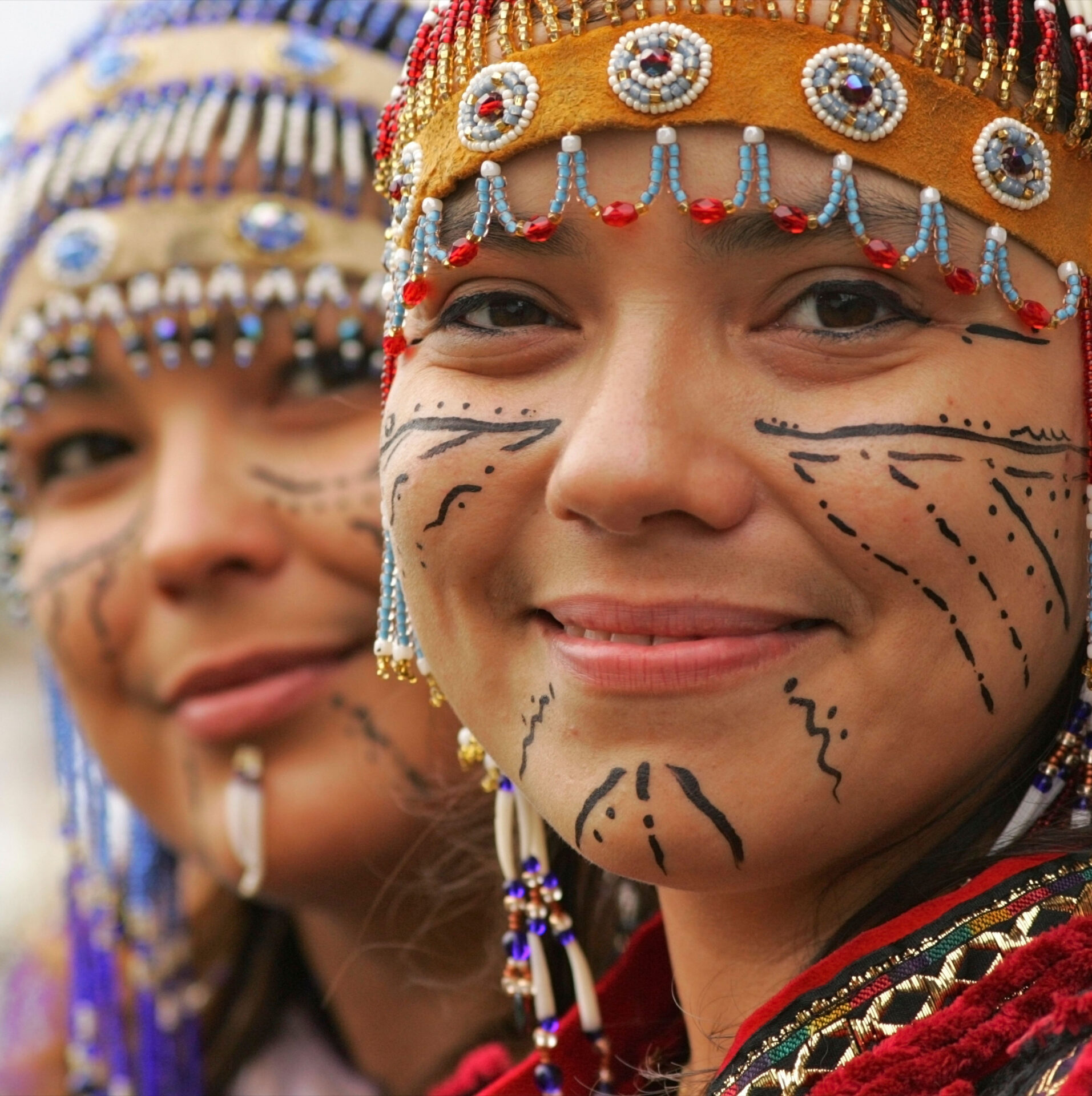 Alaska Native women in traditional headdresses